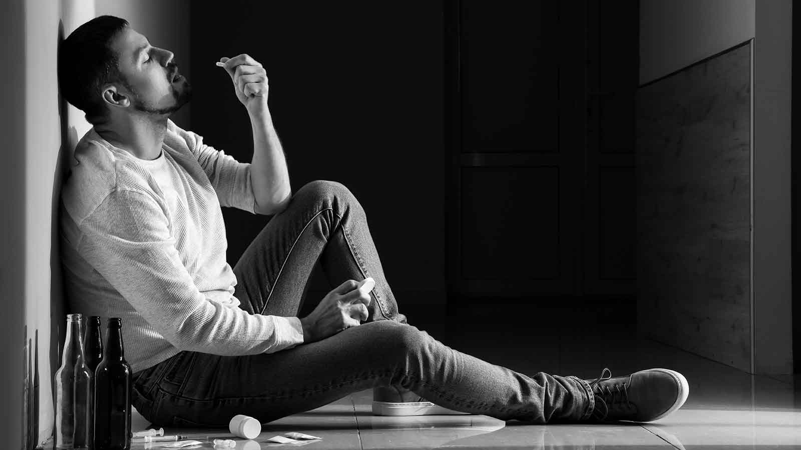 young male suffering with opioid withdrawal symptoms